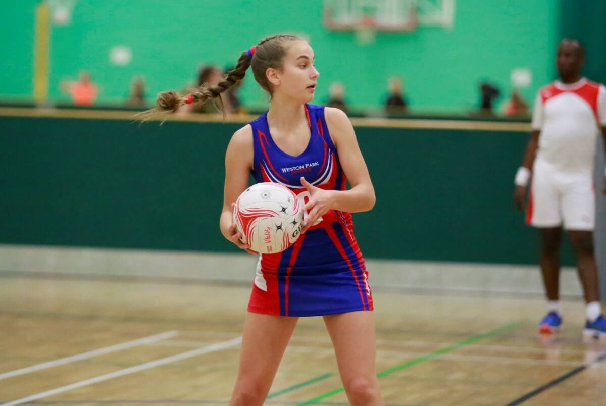 Young girl playing netball