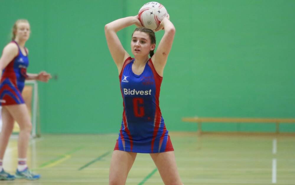 Young girl playing netball Young girl playing netball