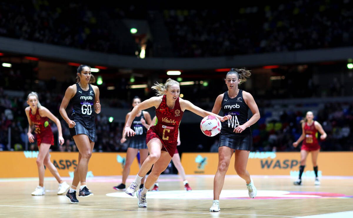 LONDON, ENGLAND - JANUARY 16: Jade Clarke of Vitality Roses and Gina Crampton of New Zealand chase the ball during the 2022 Netball Quad Series match between Vitality Roses and New Zealand at Copper Box Arena on January 16, 2022 in London, England. (Photo by Chloe Knott/Getty Images for England Netball)