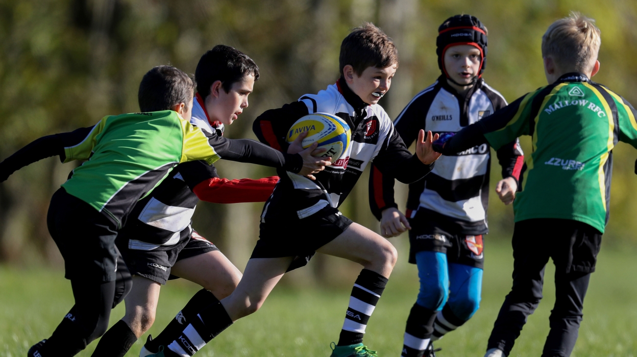 Group of mini rugby players Group of mini rugby players