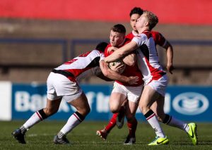 Poland is tackled by Brett Herron and Dave Shanahan.