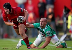 Rhys Marshall evades the tackle of Dean Budd.