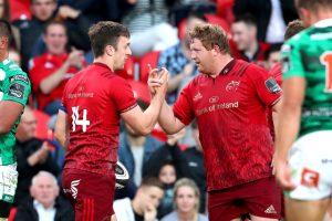 A job well done, Darren Sweetnam and Stephen Archer celebrate Munster's 34-3 win.