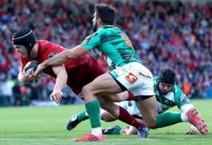 Tyler Bleyendaal scores a try despite the efforts of Titi Tebaldi.