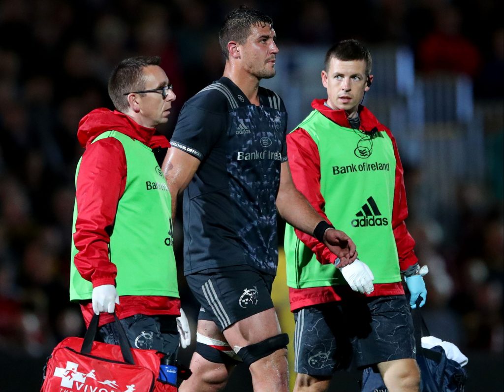 Munster's Gerbrandt Grobler with Doctor Martin McConaghy and physio Keith Thornhill.