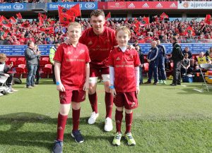 Peter O'Mahony with match mascots Cillian Ahern and Jude McGarry