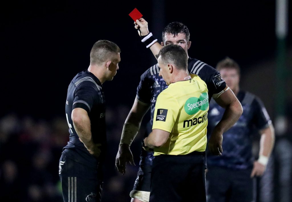 Referee Nigel Owens shows a red card to Andrew Conway.