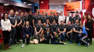 Munster Rugby players and are joined by Olive Foley and sons Tony and Dan in learning life-saving CPR skills with Irish Heart.