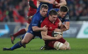 Tommy O’Donnell is tackled by Ed Byrne and Ross Byrne Mandatory Credit ©INPHO/Billy Stickland
