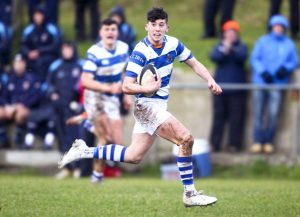 Rockwell's Dylan Farrelly on his way to scoring a try