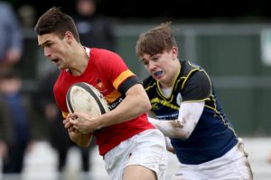 Eoghan Barrett on his way to scoring a try for CBC