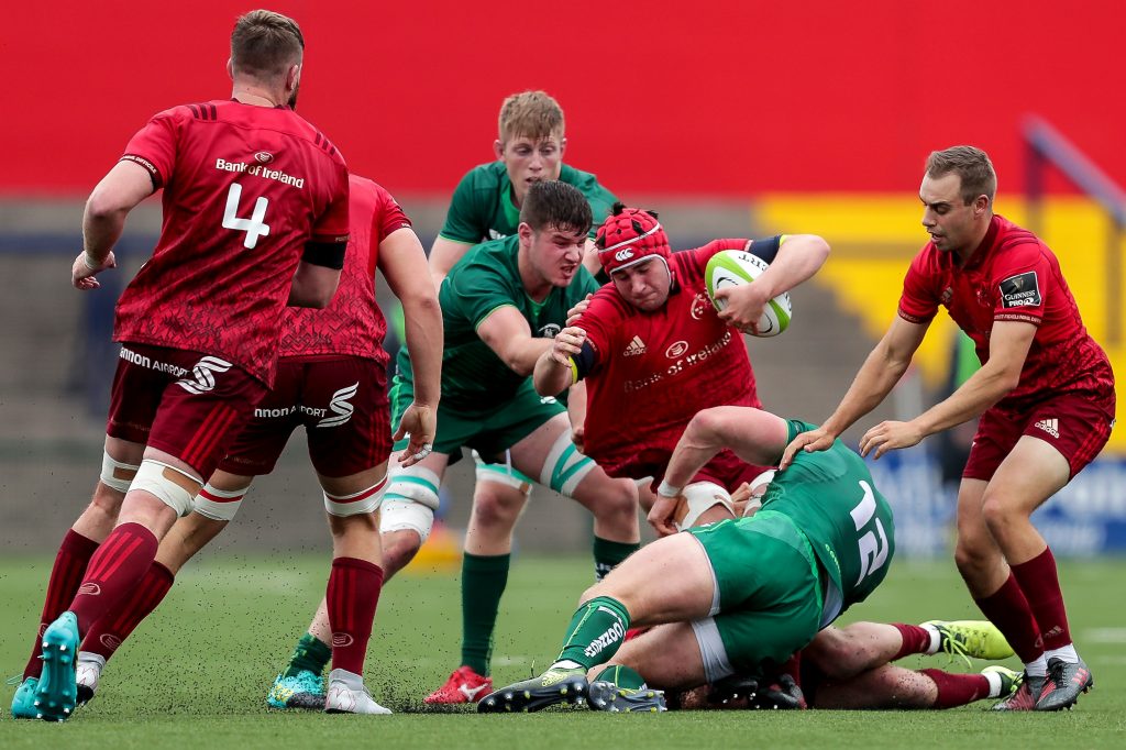 Munster's John Hodnett tackled by Peter Robb.