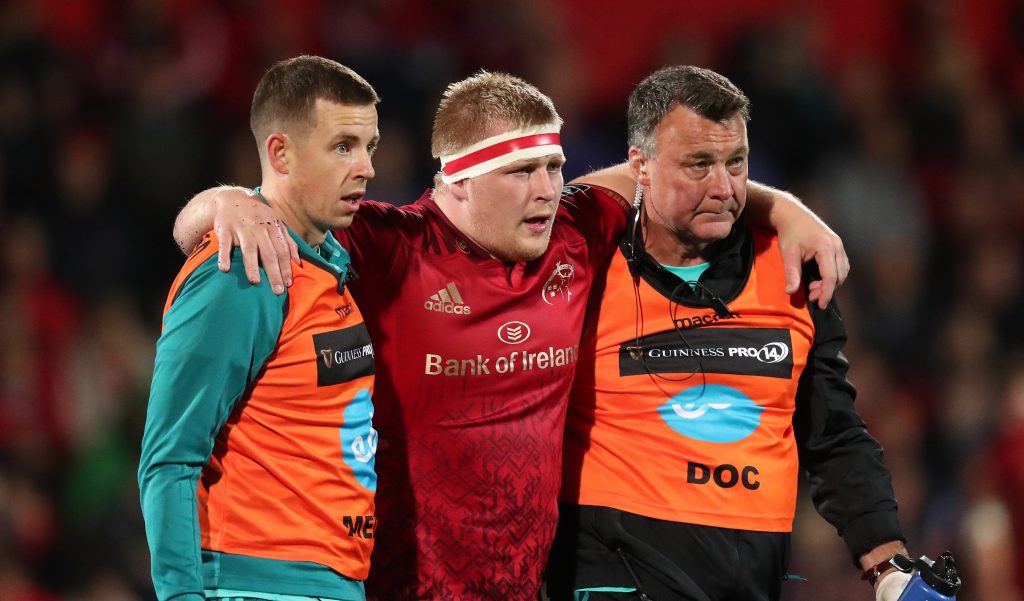 John Ryan is helped off with an ankle injury