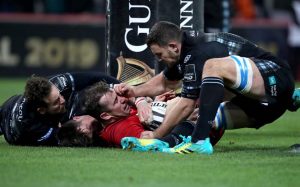 JJ Hanrahan is tackled by George Horne, Ruaridh Jackson and Adam Ashe on the try line.