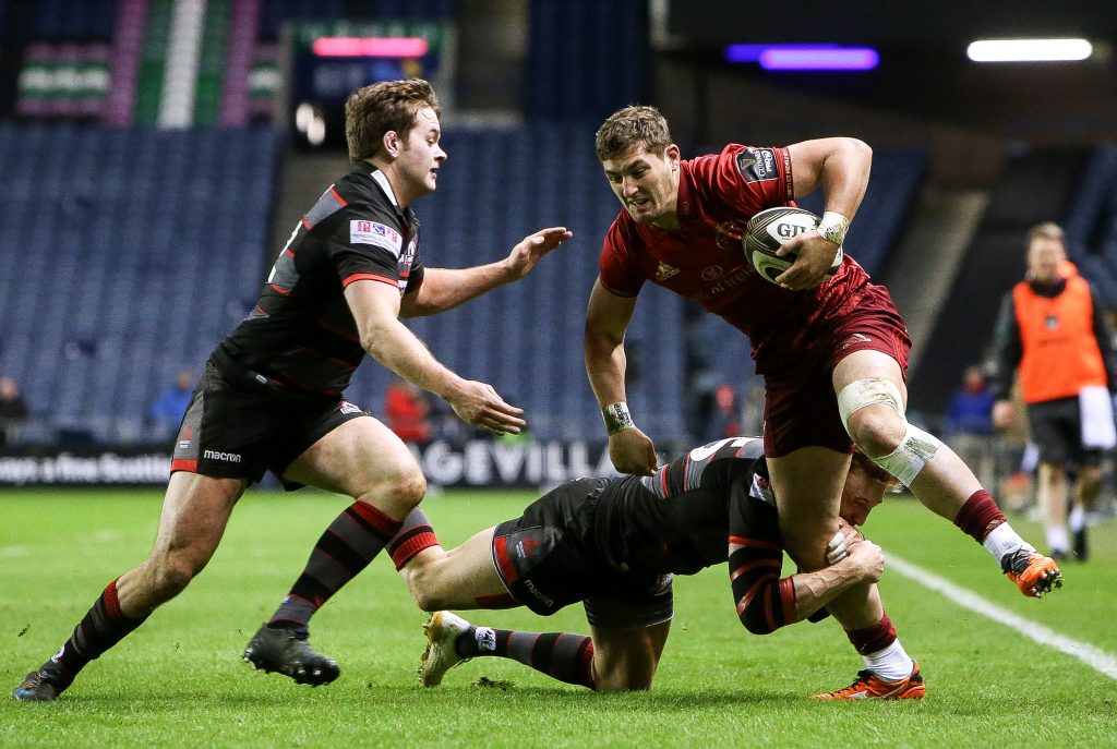 Edinburgh v Munster in Murrayfield. Dan Goggin is tackled by Chris Dean and Dougie Fife in March '18.