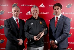 CBC's Tommy Crowe is presented with the School of the Year award by Declan English and Joey Carbery.