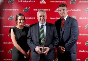 Mallow's Mike Boyle is presented with the Junior Club of the Year award by Gemma Bell and Peter O'Mahony.
