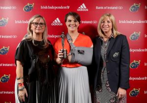 Ciara Griffin is presented with the Women's Player of the Year award by Dee Forbes and Wendy Keenan.