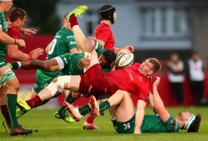 Chris Farrell is tackled by Bundee Aki and Tom Daly.