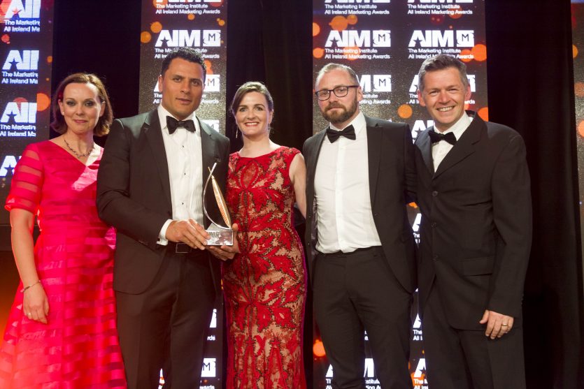 A KBC representative with Munster Rugby's Doug Howlett, Ciara Meany and Brian Cheasty, and Steven Mangan of Ringers Creative at the awards ceremony. A KBC representative with Munster Rugby's Doug Howlett, Ciara Meany and Brian Cheasty, and Steven Mangan of Ringers Creative at the awards ceremony.