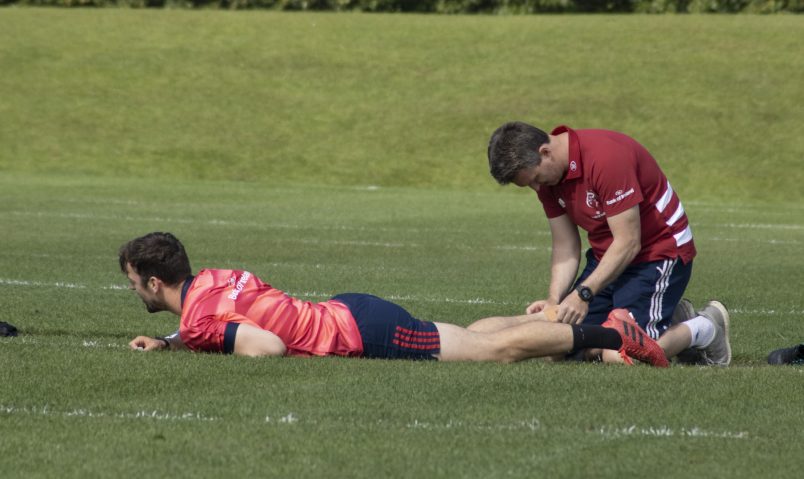 Munster Rugby Lead Physiotherapist Damien Mordan with Darren Sweetnam.