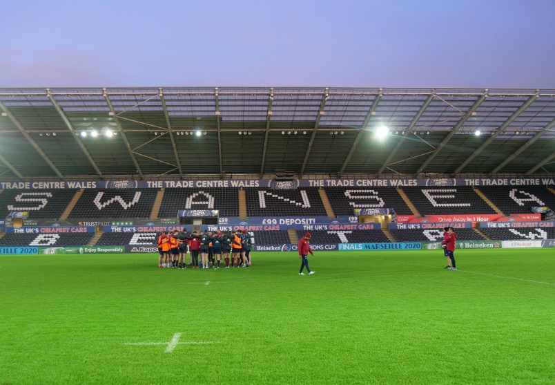 The Munster squad gather in a huddle following their captains run at the Liberty Stadium.