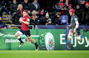 Andrew Conway streaks clear to score Munster's third try.