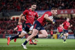 Rory Scannell runs in a try that is later disallowed as Conor Murray celebrates.