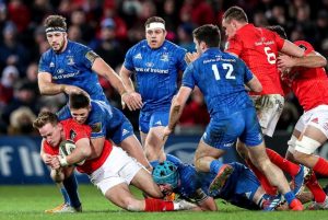 Ross Byrne tackles Mike Haley.