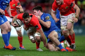Academy back-row forward Jack O’Sullivan is tackled by Conor O’Brien.