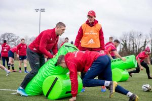 Dan Goggin on the bags with Liam Coombes making the hit under the watchful eye of Stephen Larkham.