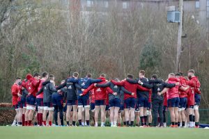 The Munster team huddle at training on Wednesday.