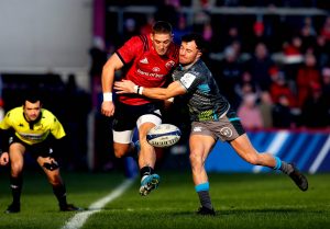 Dan Goggin chips down the line under pressure from Luke Morgan.