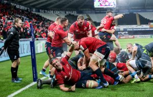 Munster players celebrate James Cronin's bonus point try against Ospreys in the Champions Cup.