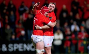 John Hodnett celebrates scoring a try with James Cronin.