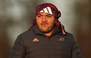 Prop Roman Salanoa doubling up the Munster training tee as headwear.