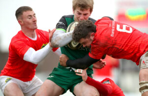 Jonathan Wren, Ethan Coughlan and Jack Daly tackle Conor Fitzgerald.