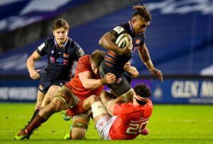 Eroni Sau is tackled by Gavin Coombes and Jack O'Sullivan.