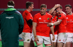 Munster players celebrate Haley's try.