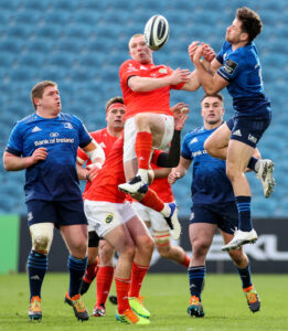 Keith Earls competes in the air with Hugo Keenan.