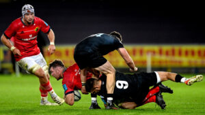 Peter O’Mahony is brought to ground by by Rhys Webb