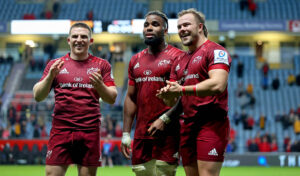 Andrew Conway, Daniel Okeke and Declan Moore celebrate after the game.