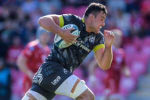 Jack O’Sullivan runs in a try against Scarlets.