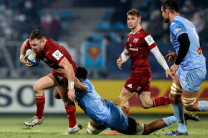 Dave Kilcoyne is tackled by Simon Meka.