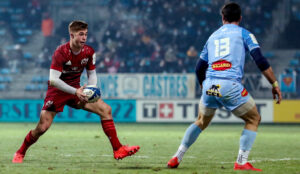 Jack Crowley comes up against Thomas Combezou.