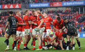 Mike Haley and Gavin Coombes celebrate with try scorer Chris Farrell.