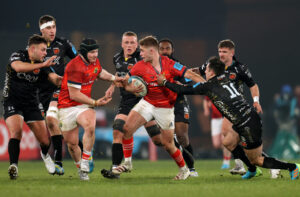 Jack Crowley looks to offload to Chris Cloete.