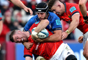Peter O’Mahony is tackled by Caelan Doris.