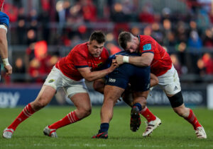 Michael Ala'alatoa is tackled by Niall Scannell and Peter O'Mahony.