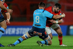 Diarmuid Barron is tackled by Elrigh Louw.